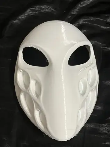 Front real product photo of the white minimalist alien mask
