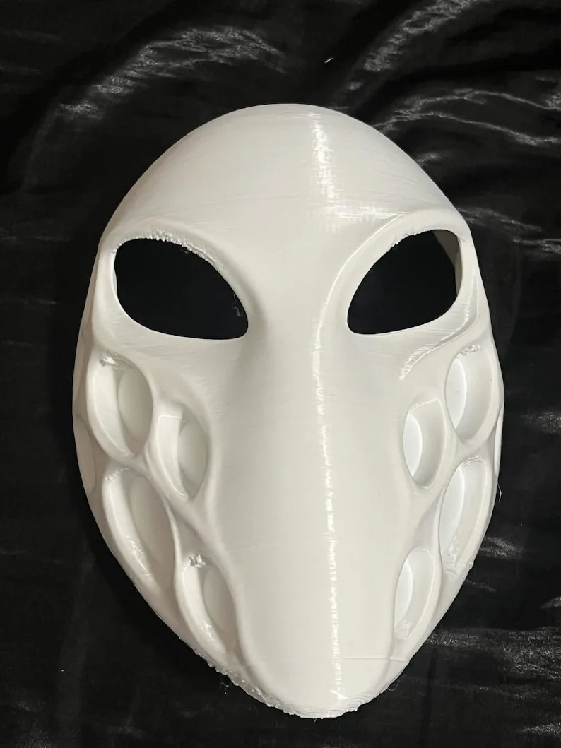 Front real product photo of the white minimalist alien mask