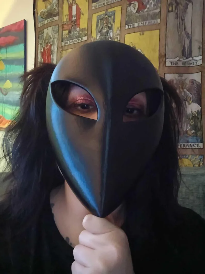 Minimalist blank mask worn in a real costume photo