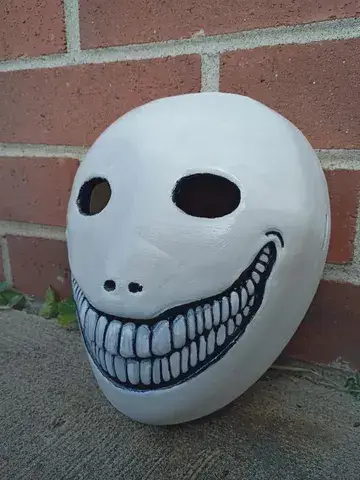 Angled real product photo of the finished Psycho Wojak mask